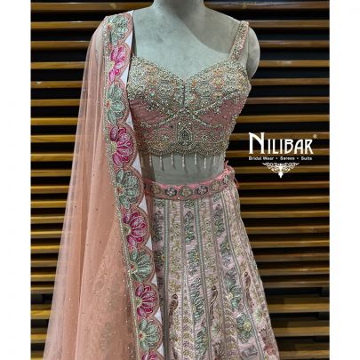 Peach Silk Crop Choli Paired With Lehenga & Net Dupatta