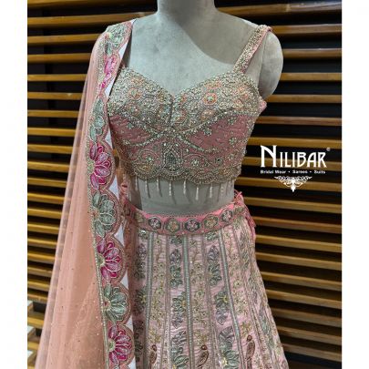 Peach Silk Crop Choli Paired With Lehenga & Net Dupatta
