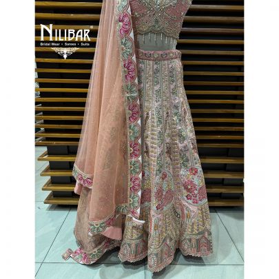 Peach Silk Crop Choli Paired With Lehenga & Net Dupatta
