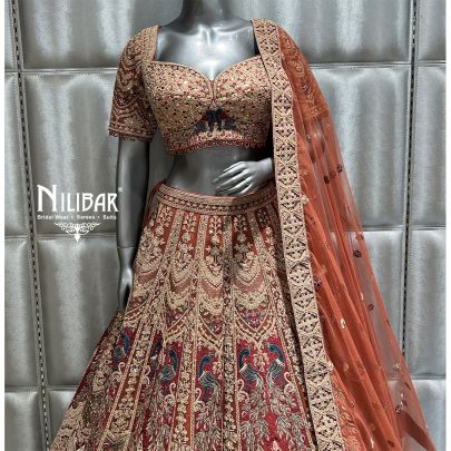 Rust and mehroon Net Bridal Lehenga