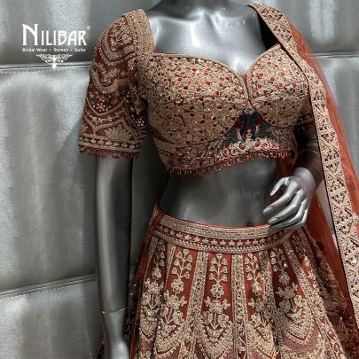 Rust and mehroon Net Bridal Lehenga