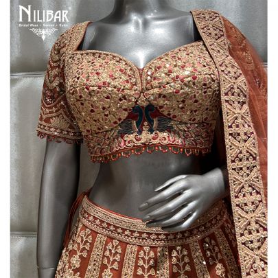 Rust and mehroon Net Bridal Lehenga