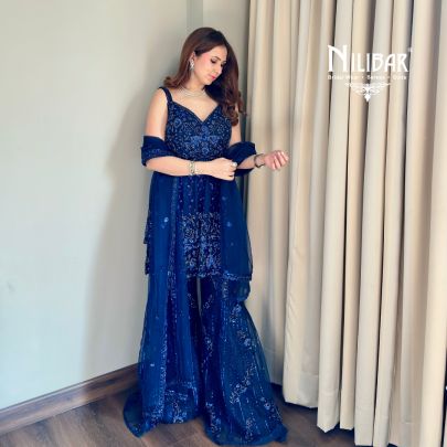 Shikha Khurrana In Our Royal Blue Net Peplum Shirt Paired With Bell-Bottom
