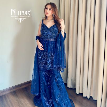 Shikha Khurrana In Our Royal Blue Net Peplum Shirt Paired With Bell-Bottom