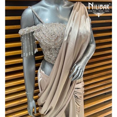 Beige Gold Net Blouse Paired With Satin Drape Saree