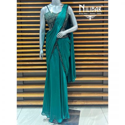 Peacock Green Net Blouse Paired With Chinnon Drape Saree