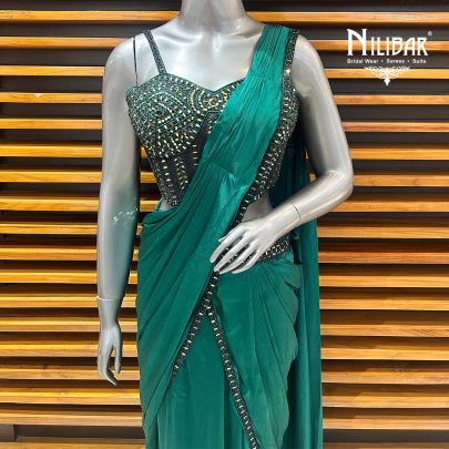 Peacock Green Net Blouse Paired With Chinnon Drape Saree