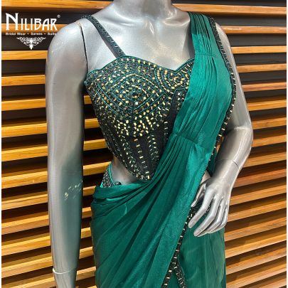 Peacock Green Net Blouse Paired With Chinnon Drape Saree