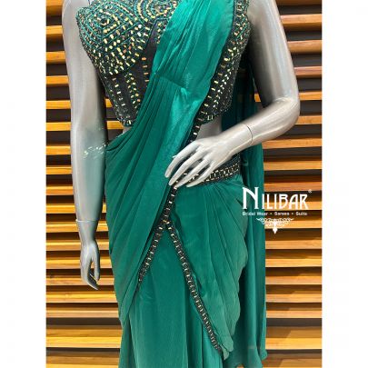 Peacock Green Net Blouse Paired With Chinnon Drape Saree