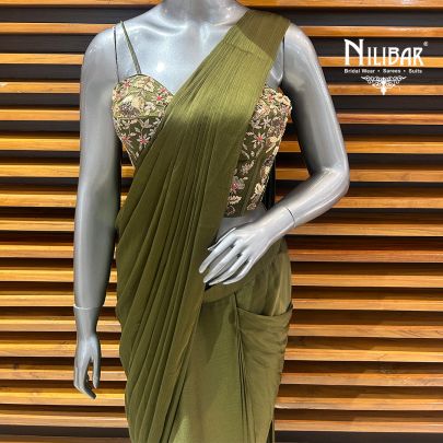 Mehandi Green Silk Blouse Paired With Chinnon Drape Saree