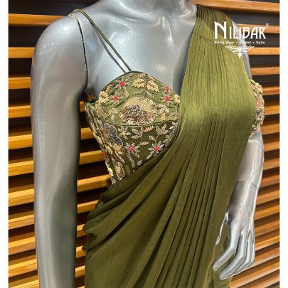 Mehandi Green Silk Blouse Paired With Chinnon Drape Saree