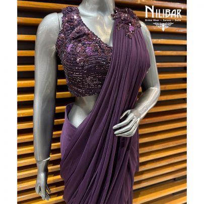 Dark Purple Net Embellished Blouse Paired With Lycra Drape Saree