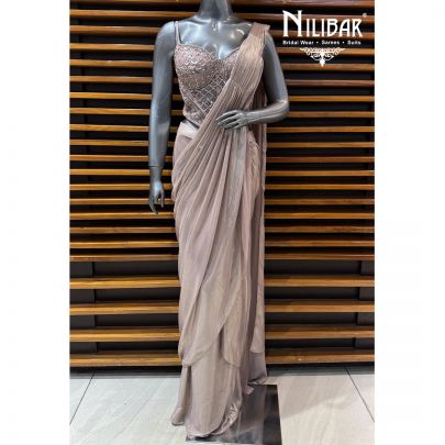 Champion Gold Corset Net Blouse Paired With Drape Tissue Saree