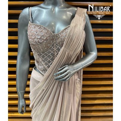 Champion Gold Corset Net Blouse Paired With Drape Tissue Saree