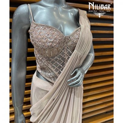 Champion Gold Corset Net Blouse Paired With Drape Tissue Saree