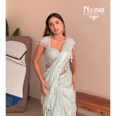 Gurman Dahelay In Our Powder Blue Shimmer Net Drape Saree