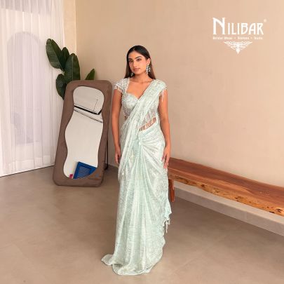 Gurman Dahelay In Our Powder Blue Shimmer Net Drape Saree