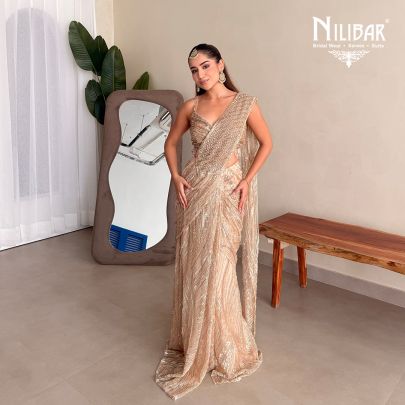 Prabhleen Dahelay In Our Beige Gold Net Drape Saree