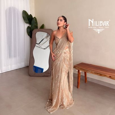 Prabhleen Dahelay In Our Beige Gold Net Drape Saree