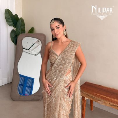Prabhleen Dahelay In Our Beige Gold Net Drape Saree