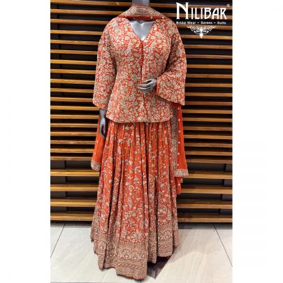 Orange Georgette Top Paired With Skirt & Dupatta