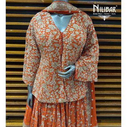 Orange Georgette Top Paired With Skirt & Dupatta