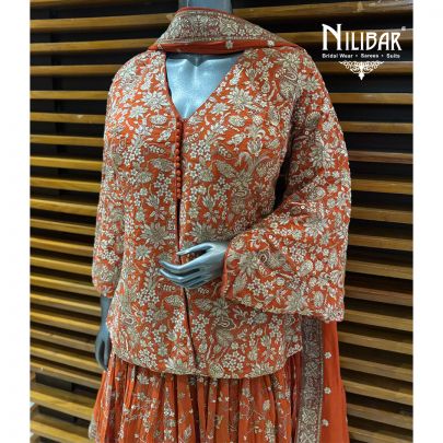 Orange Georgette Top Paired With Skirt & Dupatta