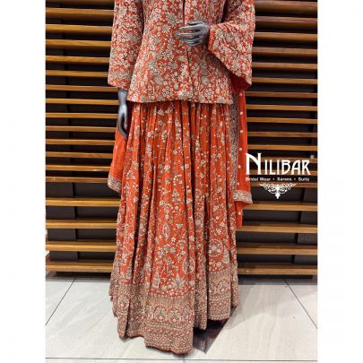 Orange Georgette Top Paired With Skirt & Dupatta