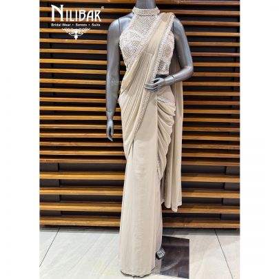 Ivory Georgette Crop Top Paired With Pleated Draped Saree
