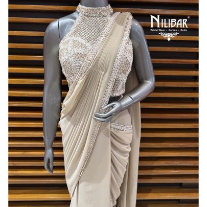 Ivory Georgette Crop Top Paired With Pleated Draped Saree