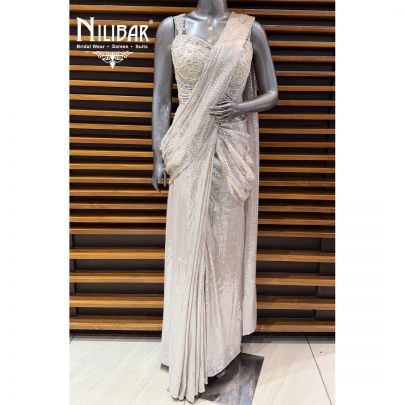 Ivory Corset Net Top Paired With Pleated Drape Saree