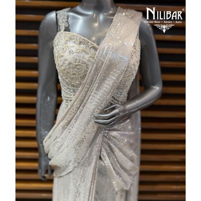 Ivory Corset Net Top Paired With Pleated Drape Saree