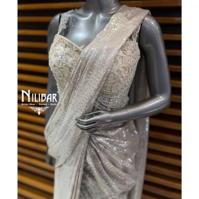 Ivory Corset Net Top Paired With Pleated Drape Saree