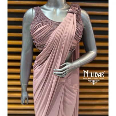 Mauve Net Choli Paired With Lycra Drape Saree