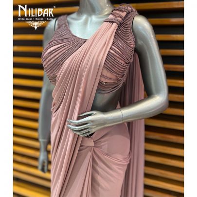 Mauve Net Choli Paired With Lycra Drape Saree