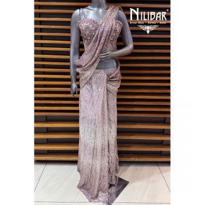 Pink Glitter Corset Net Top Paired With Pleated Drape Saree
