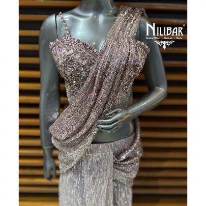 Pink Glitter Corset Net Top Paired With Pleated Drape Saree
