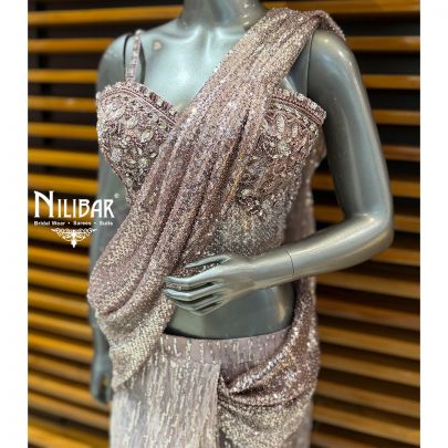 Pink Glitter Corset Net Top Paired With Pleated Drape Saree