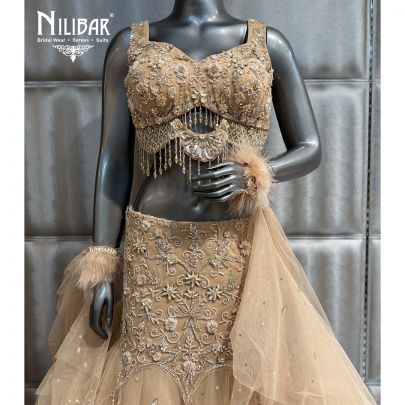 Beige Net Crop Top Paired With Fish Cut Lehenga