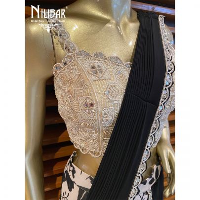 White and Black Georgette Draped Saree embellished with mirror, pearl, sequin, cutdana and dabka work.