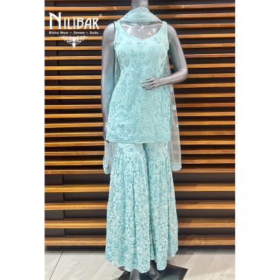 Light Blue Georgette Garara Suit Paired With Net Dupatta