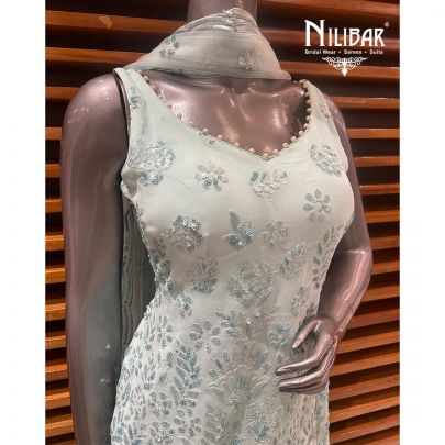 Light Blue Georgette Garara Suit Paired With Net Dupatta