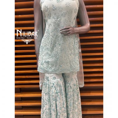 Light Blue Georgette Garara Suit Paired With Net Dupatta