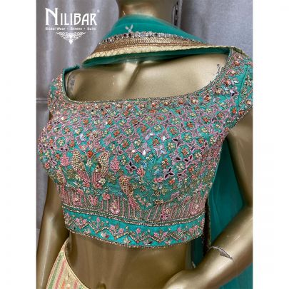 Cream Yellow and Emerald Green Georgette and Net Lehenga