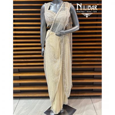 Butterscotch Net Blouse Paired With Lycra Drape Saree