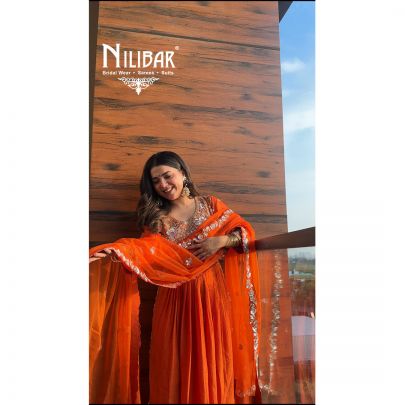 Neha Bhandari in Our Orange Silk Anarkali Suit
