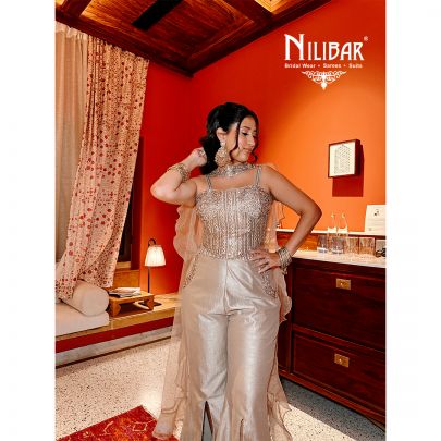 Tan Silk Corset Top Paired With Bell Bottom Pants