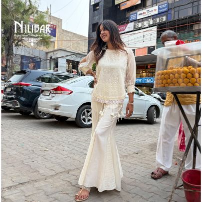 Ivory Cotton Chikankari Top Paired With Bell Bottom