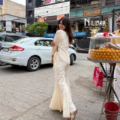 Ivory Cotton Chikankari Top Paired With Bell Bottom