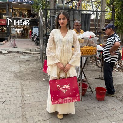 Ivory Peplum Chikankari Top Paired With Loose Palazzo